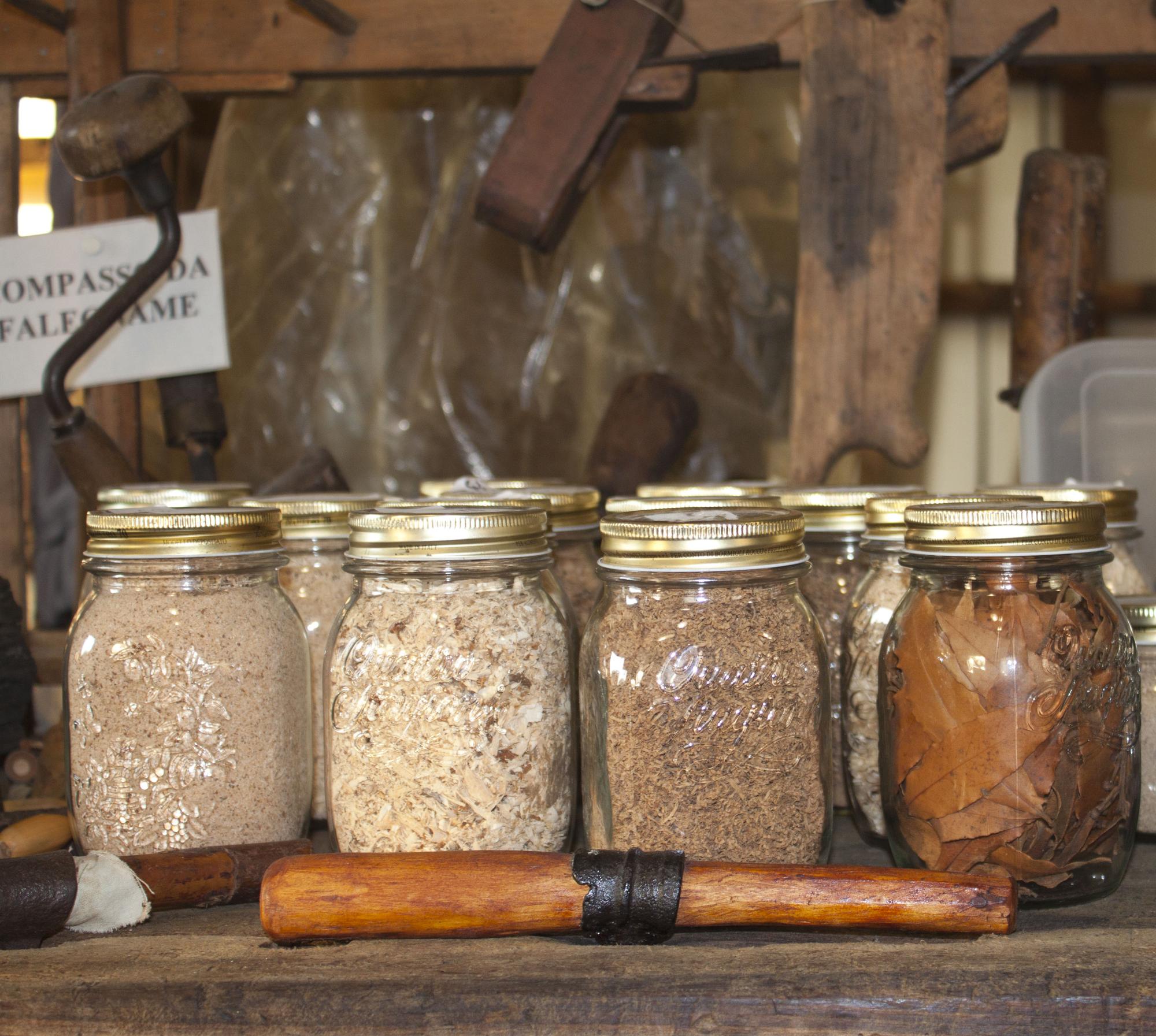 Small-batch preserves and spices on wooden table